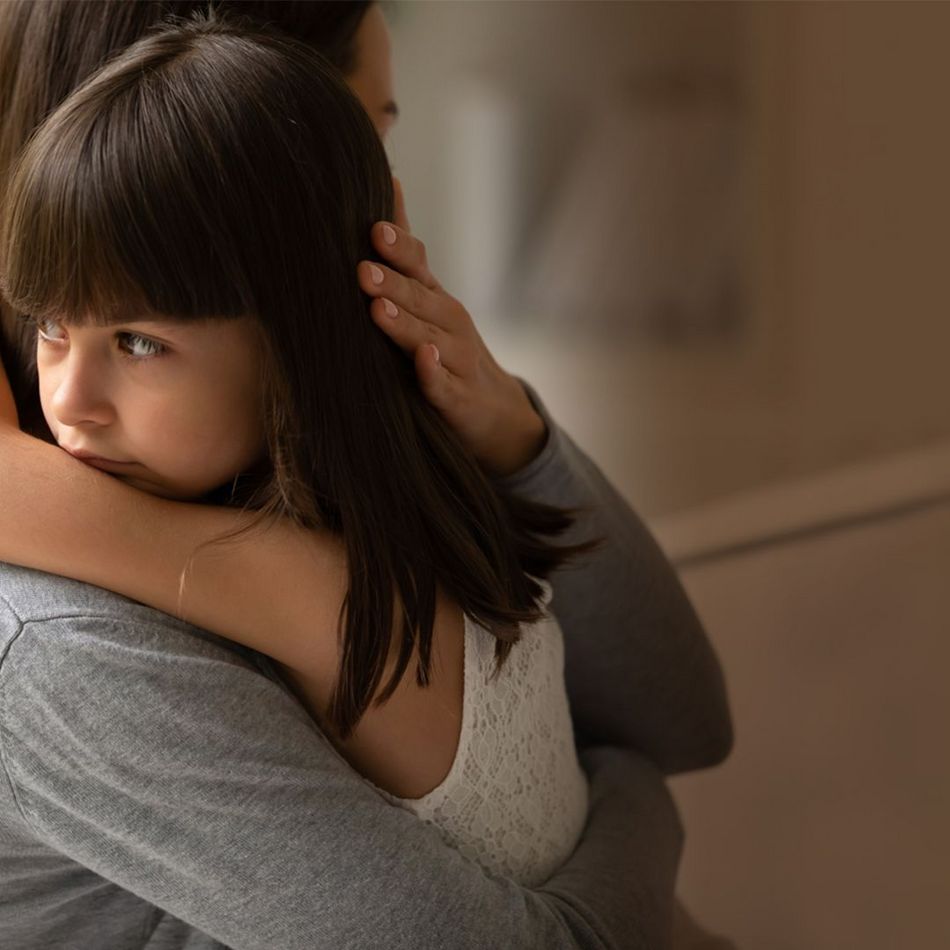 CENTOGENE Little Girl Hugged by Mother