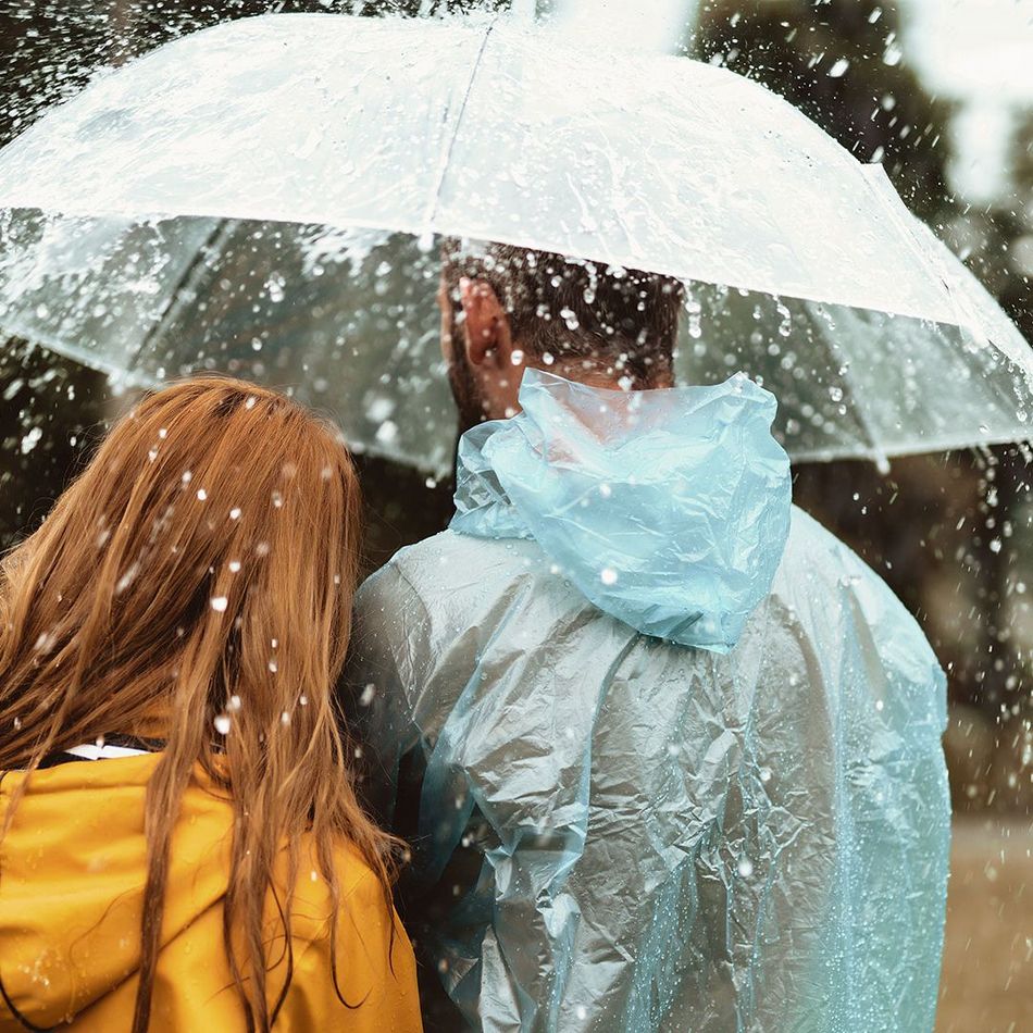 CENTOGENE People standing under umbrella in the rain
