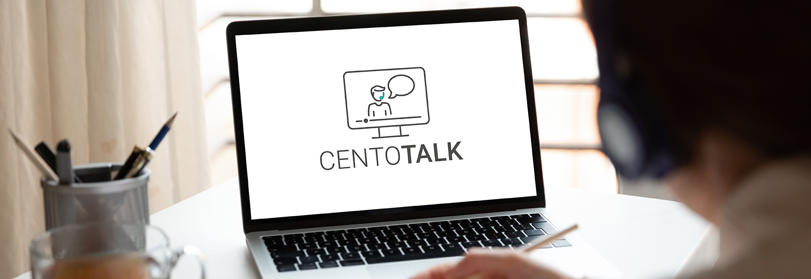 CENTOGENE Webinars CentoTalk Header Person Infront of a Screen